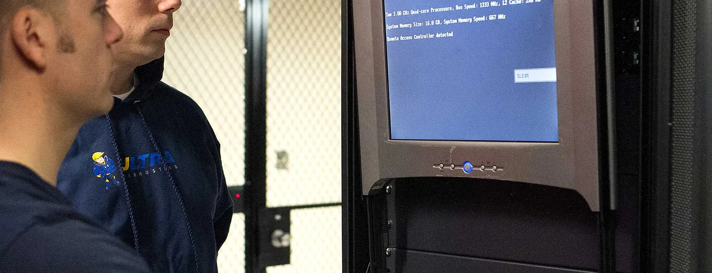 Wide view of Ultra Web Hosting staff at consoles in the on-site server room