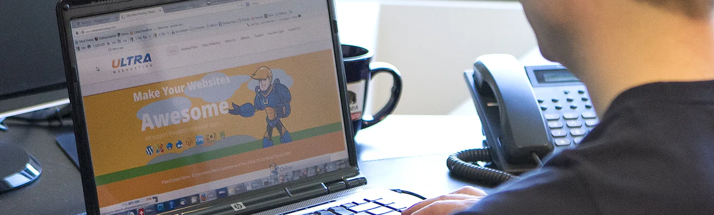 Ultra Web Hosting support technicians at their desks in the Seattle-area office