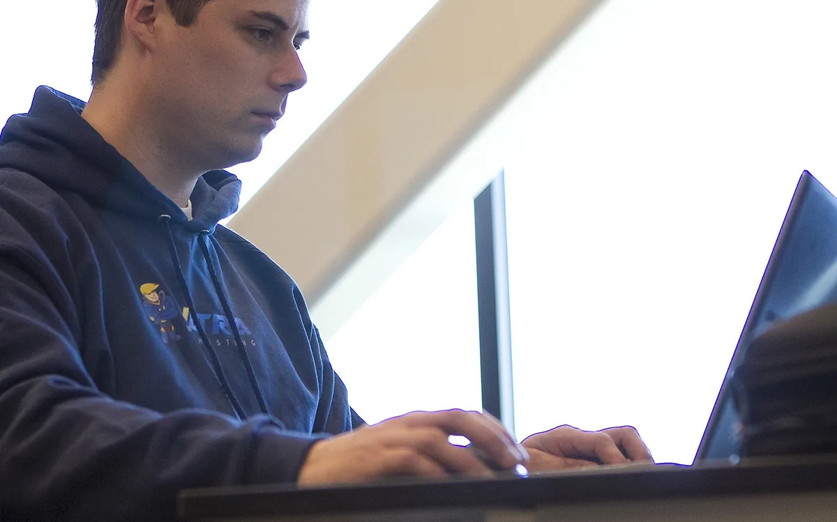 Ultra support engineer at a laptop